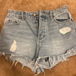 Super cute jean colored shorts with slight stylish rips!